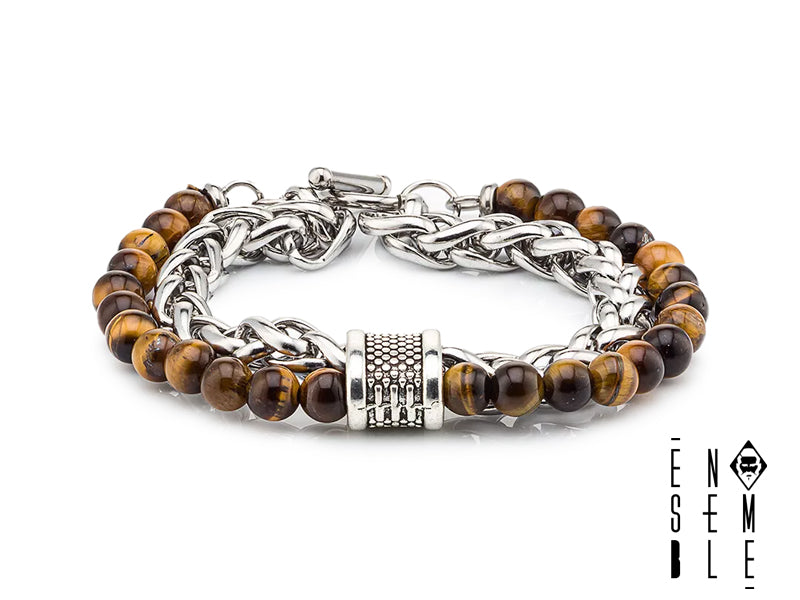Lascia che il tuo polso ruggisca! Questo braccialetto con occhio di tigre è un'esplosione di stile e potenza felina. Le sfere dorate e le maglie scintillanti creano un'armonia perfetta tra forza e delicatezza, proprio come una tigre che si muove silenziosamente nella giungla. Preparati a ricevere complimenti a ogni apparizione!