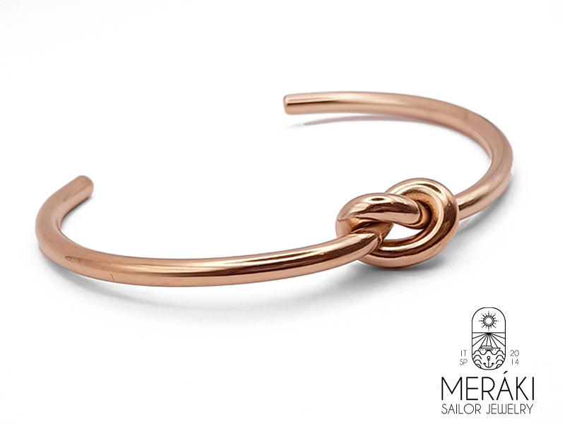 Bracciale in acciaio inossidabile rosato rappresentante il nodo dell'amicizia o nodo dell'amore