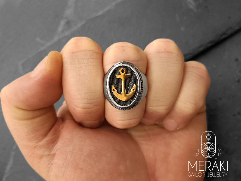 Magnific stainless steel gold anchor in silver ring