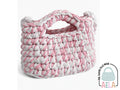 Borsa crochet artigianale in punto maglia bassa, vista frontale con manico sagomato integrato.