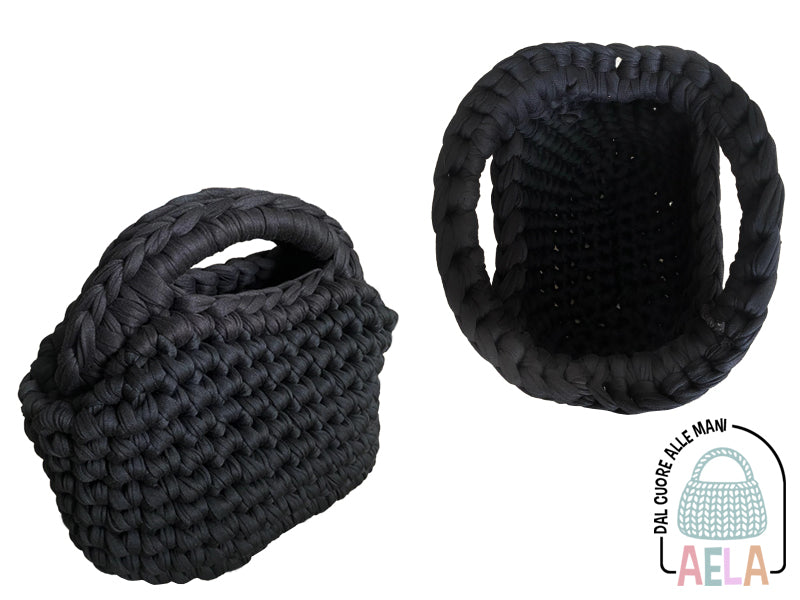 Particolare della chiusura clutch ad arco in metallo della borsa fatta a mano