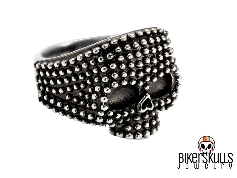 Anello Mellie punk con mezzo teschio borchiato