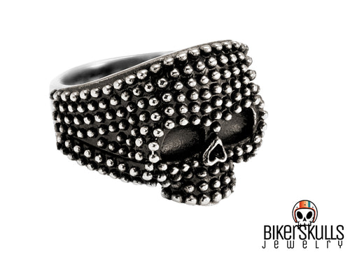 Anello Mellie punk con mezzo teschio borchiato