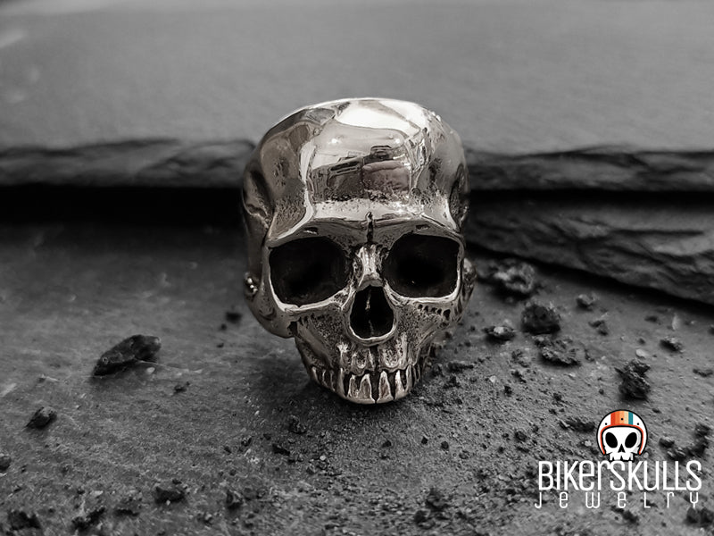Chucky ring with half skull in steel 