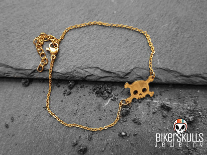 Bracciale realizzato con catenella in acciaio dorata e charm centrale a forma di teschio collezione Bikerskulls jewelry