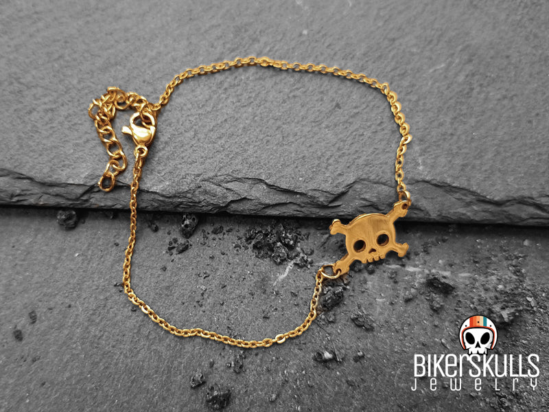 Bracciale realizzato con catenella in acciaio dorata e charm centrale a forma di teschio collezione Bikerskulls jewelry