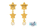 Orecchini in acciaio dorato composti da stelle pendenti e cristallo con inciso nella prima montatura “Magia” e nell’altra “Meraviglia”.