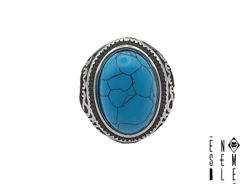 Anello in acciaio con elementi decorativi e pietra ovale turchese