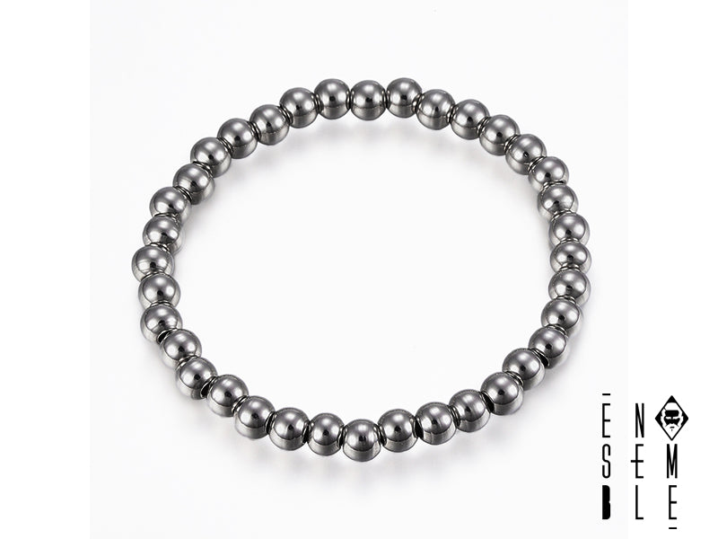 Preparati a un'ondata di eleganza magnetica! Questo braccialetto in ematite da 6mm è talmente figo che attirerà sguardi invidiosi ovunque tu vada. È come avere un piccolo pianeta al tuo polso, pronto a conquistare il mondo (o almeno la tua giornata)! 