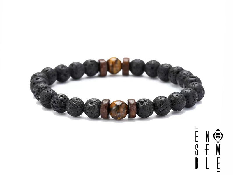 Questo braccialetto elastico è realizzato con pietre laviche vulcaniche e pietre dure selezionate, alternate da delicate rondelle in legno. Disponibile in 5 varianti: Turchese, Occhio di Tigre, Howlite, Lapislazzuli e Ametista. Ogni pietra è scelta per le sue proprietà energetiche e la sua bellezza. Il braccialetto è leggero, comodo da indossare e perfetto per ogni occasione.