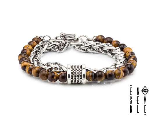 Lascia che il tuo polso ruggisca! Questo braccialetto con occhio di tigre è un'esplosione di stile e potenza felina. Le sfere dorate e le maglie scintillanti creano un'armonia perfetta tra forza e delicatezza, proprio come una tigre che si muove silenziosamente nella giungla. Preparati a ricevere complimenti a ogni apparizione!
