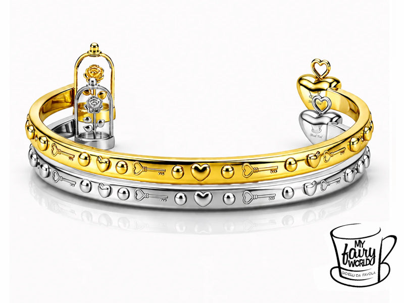 Il bordo esterno è arricchito da piccoli decori in alto rilievo con chiavi e cuori alternati con pallini, a richiamo degli elementi protagonisti del bracciale.