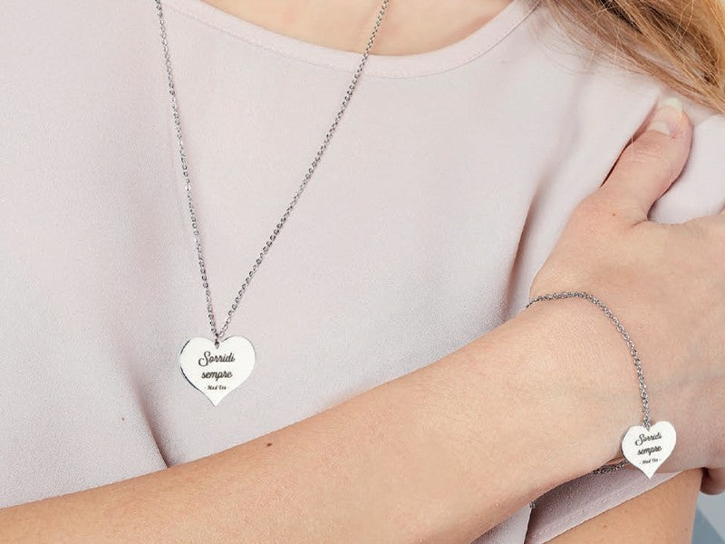 Stainless steel Dumbo collection necklace and bracelet with Sorridi sempre text