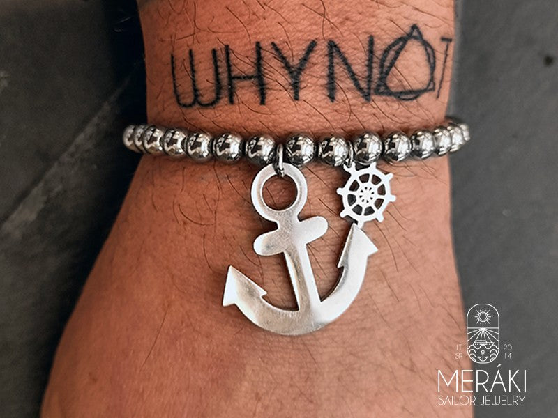 Bracciale elastico con perline, ancora e timone in acciaio 