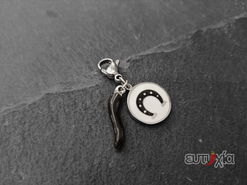 Ciondolo Enam ferro di cavallo e cornetto nero in acciaio