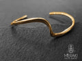 Bracciale Wave rigido design onda del mare dorato