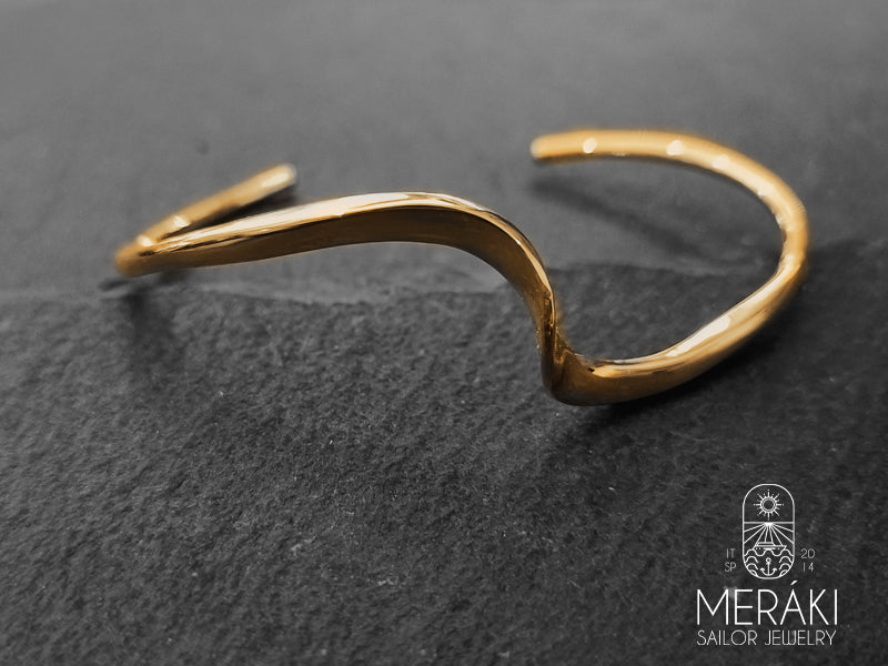 Bracciale Wave rigido design onda del mare dorato